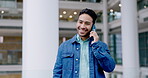 Talking, phone call and a man in a building for communication, chat or conversation with connection. Happy young asian person with a smartphone for negotiation, contact and networking or proposal