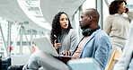 Business people, talking and waiting in airport for travel, airplane or flight departure from international terminal lounge or lobby. African, businessman and woman in conversation for networking