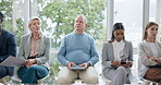 Waiting room, business people and in a row in an office for a meeting, working or an interview. Company, hiring and diversity with group of corporate employees sitting for professional recruitment