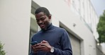 Black man in city with smile, phone and typing text or checking social media post online. Connection, cellphone and person reading email, meme or networking while walking on urban street in Africa.