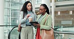 Discussion, tablet and business woman in the office planning project together by the escalator. Conversation, online and professional female employees or friends doing research on digital technology.