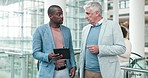 Collaboration, tablet and businessmen in the office in discussion for planning project together. Conversation, online and professional male employees or friends doing research on digital technology.