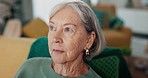 Face, anxiety and senior woman on a sofa thinking, fear and worry, lonely and stress in a nursing home. Doubt, memory loss and elderly female in a living room with dementia, grief or Alzheimer crisis