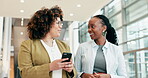 Business people, talking and walking with a phone in office for internet connection or communication. Ideas, partner and entrepreneur women together for social media, networking or chat with contact