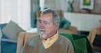 Thinking, dreaming and senior man on a chair in the living room of his retirement home. Calm, relax and peaceful elderly male person with an idea, vision or brainstorming in the lounge of his house.