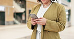 Woman, hands and walking in office building with smartphone for social network, mobile website and digital contact. Closeup of worker typing on phone, reading business notification and app in lobby