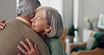 Hug, happy and a senior couple in a nursing home for care, support and help. Smile, love and an elderly man and woman in a living room together during retirement with trust, bonding and a visit