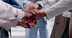 Hands, motivation and support with a business team in a huddle while at the office for collaboration. Teamwork, diversity and partnership with an employee group in the workplace for solidarity