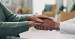 Holding hands, closeup and nursing home with doctor, support and faith with senior person in retirement. Nurse, elderly patient and homecare with praying, empathy and solidarity for healing in clinic