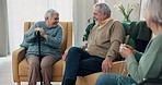 Speaking, laughing and senior friends in the living room of their nursing or retirement home. Happy, conversation and group of elderly people with disability talking in the lounge together at house.