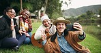 Camping, selfie and friends at a forest lake bond, happy and and enjoying guitar music in nature. Smartphone, profile picture and group of people relax in the woods, fun and enjoying freedom at river