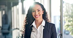 Face, smile and a professional business woman in the office with a positive mindset about the company mission. Portrait, happy and young female corporate employee in the workplace with satisfaction 