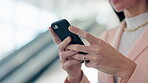 Phone, consultant and hands of woman typing in office lobby for social media, research app and networking. Smartphone, business professional and scroll on internet, website and online chat in company