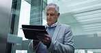 Man, tablet and manager in elevator of office building for planning research, online report and business information. Senior CEO, boss and digital technology in lift for social network, data and app