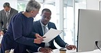 Documents, computer and senior manager, business people or mentor review financial information, research or data. Administration, corporate leader and black man advice on accounting finance paperwork
