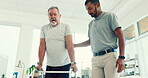 Man, physiotherapist and patient in elderly care with walker for physical therapy or assessment at the clinic. Male medical caregiver helping senior in physiotherapy to walk in healthcare support