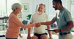 Physiotherapy, handshake and chiropractor with senior couple greeting for medical care, consulting and recovery. Man with male and woman on tablet for physical therapy, rehabilitation and healthcare