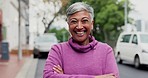 Happy, city and face of a woman with arms crossed for business, corporate work or career. Laughing, manager and portrait of a mature boss or ceo in the street with confidence in an urban road