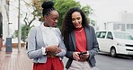 Business women, conversation and city with phone and break on a street with communication. Travel, happy and career commute outdoor with people on urban sidewalk walking to job with female friends