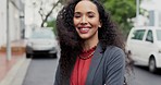 Face, arms crossed and a business woman in the city for travel or commute to work in the morning. Portrait, smile and mindset with a happy young female professional employee outdoor in an urban town