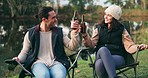 Cheers, nature and couple with beer on a camp for a romantic outdoor weekend trip together. Happy, toast and young man and woman drinking an alcohol beverage in the woods or forest while on a holiday