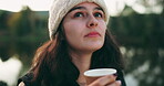 Face, thinking and hiking with a woman drinking coffee outdoor while in nature for travel, freedom or adventure. Idea, camping and vacation with a young female hiker in the forest or woods closeup