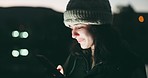 Woman, phone and scrolling at night in city for communication, social media or outdoor networking. Female person with smile for online browsing in the late evening on mobile smartphone app outside