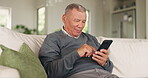 Relax, phone and search with old man on sofa for social media, communication or happy. Smile, happiness and technology with senior person in living room at home for website, retirement and mobile app