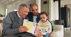 Grandfather, dad and girl reading a book, home and education with quality time, happiness or learning. Child development, male parent or old man on a couch, literature or bonding with a kid or growth