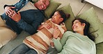 Home, family and holding hands in living room with smile, love and parent care of mom, kid and father. Bonding, dad and mother on house floor laughing in lounge with funny joke and happy with child
