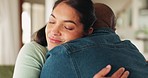 Home, hug and couple with love, smile and marriage with quality time, relationship and happiness. Romance, woman and man embrace, apartment and relax with care, support and affection in a living room