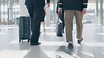 Luggage, airport lobby and pilot walking with bag for flight, schedule or international transportation job. Men, suitcase and team together for global travel, airplane and ready to start working