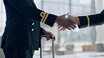 Pilot, handshake and person with welcome, hello and well done, gesture or good luck with travel journey. Airport, captain and people shaking hands for flight, teamwork or support with collaboration 