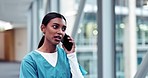 Phone call, nurse and Indian woman in hospital for conversation, online consulting and telehealth. Healthcare, clinic and female worker on smartphone for communication, medical support and talking