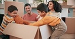 Moving in, toys and family unpacking boxes in their new home bonding and playing together. Happy, smile and young parents being playful with teddy bears with their boy children in a modern house.