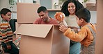 Moving in, toys and family with boxes in their new home bonding, unboxing and playing together. Happy, smile and young parents being playful with teddy bears with their boy children in a modern house