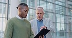 Tablet, discussion and manager talking to a businessman on a corporate project in the office. Professional, conversation and senior male leader speaking to African colleague with a digital technology