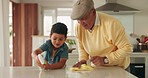 Wipe, family and cleaning counter with grandpa and child in a kitchen with development and support. Spray, learning and care with senior man and young kid together in home with cleaner and teaching