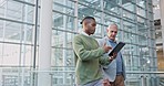 Tablet, conversation and manager talking to man on a corporate project in the office. Professional, discussion and senior male leader speaking to African business colleague with a digital technology.