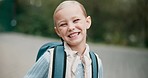 Back to school, child and face with a smile on campus for education, kid development and student learning. Young girl, portrait and school backpack ready for kindergarten feeling excited outdoor