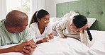 Man, woman and child on bed to relax, talk and quality time together, happy interracial family in home. Discussion, bonding and girl in bedroom with mother, father and smile in morning conversation.