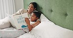 Bed, girl and mother reading a book, relax and home with child development, quality time and support with education. Family, kid or female parent with daughter, storytelling in a bedroom or happiness