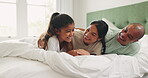 Happy, relax and funny with family in bedroom for playful, morning and love. Happiness, support and laughing with parents and child playing in bed at home for games, wake up and excited together