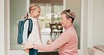 Mom, kid and backpack, hugging before school and getting ready at front door in morning. Smile, proud mother and girl child with bag, excited for learning and development, study with love and support