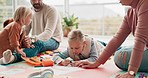 Parents, children and drawing on floor in home for bonding, teaching and learning together. Color pencil, paper and father, mother and kids in creative play for development, quality time and family.