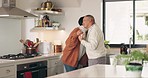 Old couple in kitchen, coffee and communication, relax with morning routine and conversation with trust and bonding. Commitment, marriage and retirement, man and woman at home, tea and chat with hug