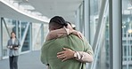 Hug, excited and a couple at the airport with love, hello and welcome from a vacation. Together, happy and a young man and woman with care from a holiday flight, journey or reunion after travel