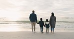 Beach, vacation and back of family holding hands and walking together on a travel adventure. Freedom, outdoor and boy children bonding with their parents by the ocean on a holiday or weekend trip.