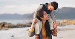 Mother, carrying kid and happy at beach on vacation, holiday and travel outdoor at winter sunset. Mom, child smile and piggyback at ocean, sea and bonding for family time, play and love with care