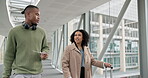 Airport, suitcase and business people walking together for an international trip while planning. Luggage, teamwork or collaboration with a professional man and woman employee in a terminal for travel